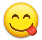 Cara sorridente, a lamber os lábios Emoji LG