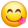 Улыбающееся лицо, облизывающее губы Эмодзи на телефонах Samsung