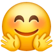 🤗 Cara feliz de mãos abertas para um abraço Emoji nos Samsung